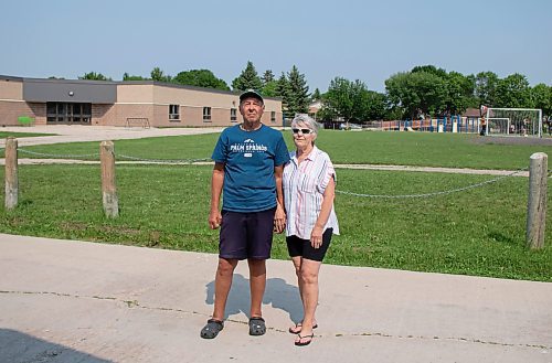 Mike Thiessen / Winnipeg Free Press 
Viktor (left) and Laura Lewin are concerned with the lack of a fence between OV Jewitt Community School and the back lane near their property, which has resulted in disruption to the yards of the couple and their neighbours. 230609 &#x2013; Friday, June 9, 2023