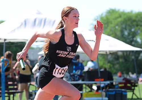 Anne Forman gets the Vincent Massey 4x100 relay team off to a good start at Brandon’s UCT Stadium during the Manitoba High School Sports Association’s track and field provincials on Saturday afternoon. (Perry Bergson/The Brandon Sun)