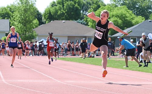 Vincent Massey’s Kendra Schram (1145) leaps across the finish line as the Vikings won the 4x100 relay at Brandon’s UCT Stadium during the Manitoba High School Sports Association’s track and field provincials on Saturday afternoon. (Perry Bergson/The Brandon Sun)