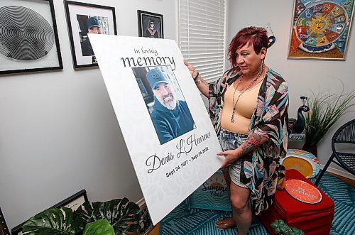 JOHN WOODS / WINNIPEG FREE PRESS
Lise Leveille, widow of Denis L&#x2019;Heureux who was killed when his motorcycle hit wet mud on a highway September 24/22, is photographed in a memorial area for Denis in her Winnipeg home, Monday, June 12, 2023. Leveille is working to get MB govt to make it law that signs must be posted when construction/farm debris is on the road surface.

Reporter: kitching