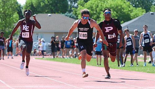 Kevin Garcia (1160) leaps over the finish line as the Vincent Massey Vikings boys varsity 4x100 relay team won gold at Brandon&#x2019;s UCT Stadium during the Manitoba High School Athletic Association&#x2019;s track and field provincials on Saturday afternoon. (Perry Bergson/The Brandon Sun)
