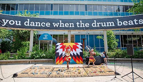 Mike Deal / Winnipeg Free Press
Sisters Charisma (left) and Kimberly Mason (right) during a hoop dancing performance at the event.
A noon-hour event held by the Downtown Winnipeg BIZ included a reveal of the concept plan and design intent for the future of the Air Canada Window Park on the corner of Carlton and Portage as well as the annual planting and celebration by volunteers and the Downtown Winnipeg BIZ Streetscape Team.
230612 - Monday, June 12, 2023.