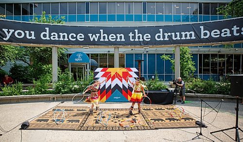 Mike Deal / Winnipeg Free Press
Sisters Charisma (right) and Kimberly Mason (left) during a hoop dancing performance at the event.
A noon-hour event held by the Downtown Winnipeg BIZ included a reveal of the concept plan and design intent for the future of the Air Canada Window Park on the corner of Carlton and Portage as well as the annual planting and celebration by volunteers and the Downtown Winnipeg BIZ Streetscape Team.
230612 - Monday, June 12, 2023.