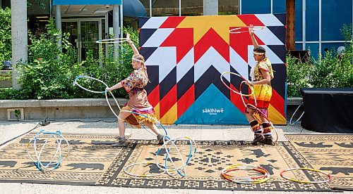 Mike Deal / Winnipeg Free Press
Sisters Charisma (right) and Kimberly Mason (left) during a hoop dancing performance at the event.
A noon-hour event held by the Downtown Winnipeg BIZ included a reveal of the concept plan and design intent for the future of the Air Canada Window Park on the corner of Carlton and Portage as well as the annual planting and celebration by volunteers and the Downtown Winnipeg BIZ Streetscape Team.
230612 - Monday, June 12, 2023.