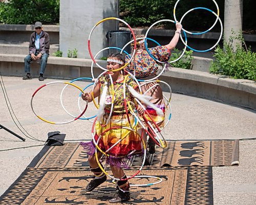 Mike Thiessen / Winnipeg Free Press 
Charisma Mason (front) and Kimberly Mason perform a traditional hoop dance at Air Canada Park&#x2019;s annual planting and celebration event. The plan for Air Canada Park&#x2019;s redesign was announced at today&#x2019;s event. For Malak Abas. 230612 &#x2013; Friday, June 12, 2023