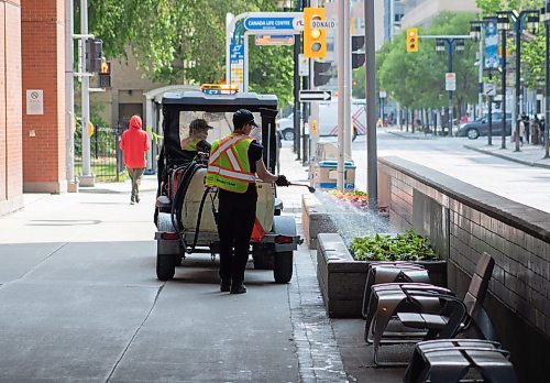 Mike Thiessen / Winnipeg Free Press 
Winnipeg city crew watering flowerbeds along Graham Avenue. 2301612 &#x2013; Monday, June 12, 2023