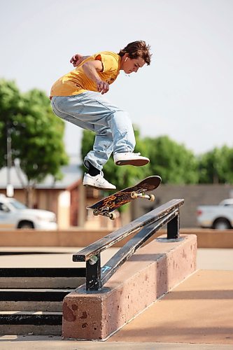12062023
Austin Chubey of Brandon kickflips into a bluntslide while skateboarding at the Kristopher Campbell Memorial Skatepark on Monday during a demo/ best trick contest with members of Winnipeg's Sk8 Skates team and Brandon's Recovery Skateshop team. 
(Tim Smith/The Brandon Sun)