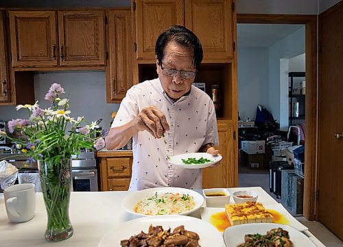 JESSICA LEE / WINNIPEG FREE PRESS

Rod Cantiveros likes his adobo with garlic fried rice, mango-tomato salad and buttery mushrooms.