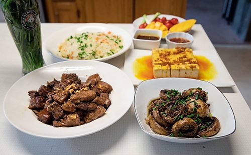 JESSICA LEE / WINNIPEG FREE PRESS

Pork belly adobo (left) made by Rod Cantiveros with his preferred side dishes.

Reporter: Eva Wasney