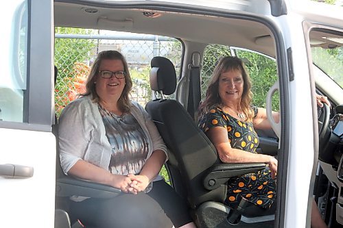 Cynamon Mychasiw, CEO of the United Way Brandon and District and Judy Dandridge, chair of the board of directors for Family Visions, sit in the 2019 Dodge Grand Caravan converted for someone in a wheelchair with a ramp for easy access and room for four other passengers and a driver in Brandon on Tuesday. (Michele McDougall/The Brandon Sun)  