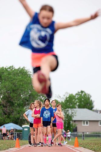 13062023
Grade five girls compete in the long jump event at the Brandon School Division City Wide Track Meet at the UCT Stadium on Tuesday. 
(Tim Smith/The Brandon Sun)
