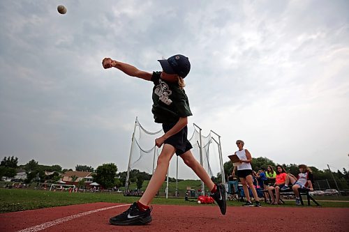 13062023
Zai Mansoff, a grade four student from Green Acres School, competes in the ball throw event at the Brandon School 
Division City Wide Track Meet at the UCT Stadium on Tuesday. 
(Tim Smith/The Brandon Sun)