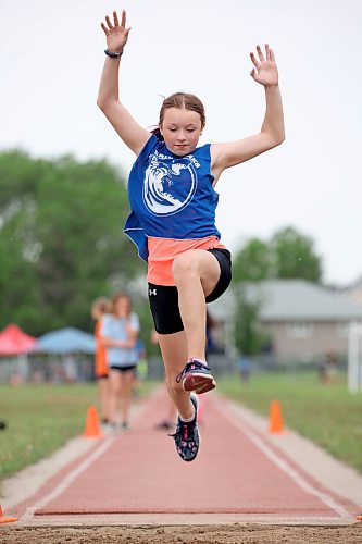 13062023
Kensley Wilson, a grade five student from Waverly Park School, competes in the long jump event at the Brandon School Division City Wide Track Meet at the UCT Stadium on Tuesday. 
(Tim Smith/The Brandon Sun)