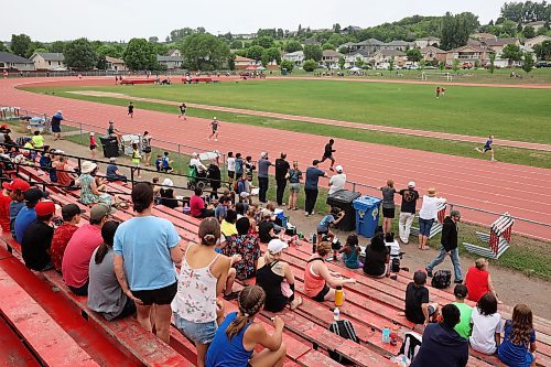 13062023
Parents watch the Brandon School Division City Wide Track Meet at the UCT Stadium on Tuesday. 
(Tim Smith/The Brandon Sun)
