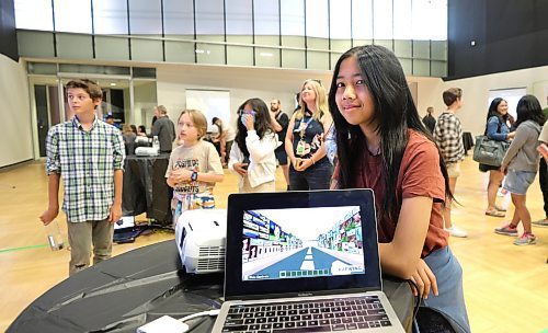 RUTH BONNEVILLE / WINNIPEG FREE PRESS

LOCAL - Level Up - Minecraft

Macie Pangilinan shows off her version of Winnipeg in a video format known as Minecraft at Level Up Winnipeg Tuesday.   Students were challenged to build their own virtual worlds in the game to answer the question, &#x488;ow can we envision a connected, equitable, and sustainable downtown that moves Winnipeg forward without leaving anyone behind?&#x4cd;
 A showcase of students projects created through the Level Up: Winnipeg challenge that started in April, took place at Canadian Museum for Human Rights (CMHR) on Tuesday. 


June 13th, 2023


