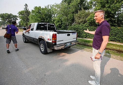 JOHN WOODS / WINNIPEG FREE PRESS
Maxime Bernier, leader of the People&#x2019;s Party of Canada (PPC), points out one of his bumper stickers on a truck as he canvasses residents in Roland, Manitoba, Tuesday, June 13, 2023. Bernier is running in the Portage-Lisgar by-election.

Reporter: sanders