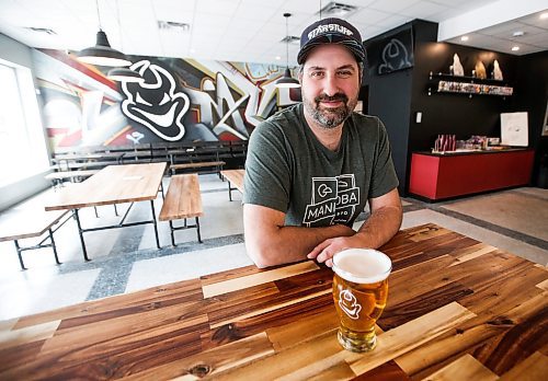 JOHN WOODS / WINNIPEG FREE PRESS
Devil May Care brewpub co-owner Colin Koop is photographed in the pub Tuesday, April 25, 2023. Koop is hoping there is another playoff game in the city. 

Re: kitching