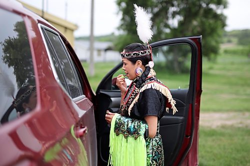 15062023
Fancy Shawl dancer Katrina Blackwolf gets dressed in her regalia prior to the grand entry at the Sioux Valley Elementary School Pow Wow at Sioux Valley Dakota Nation on Thursday. Students joined members of the community for the afternoon pow wow.   (Tim Smith/The Brandon Sun)
