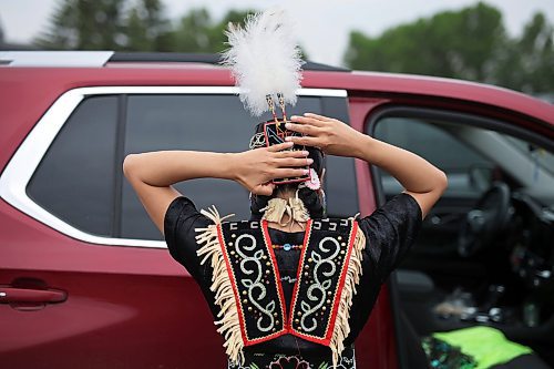 15062023
Fancy Shawl dancer Katrina Blackwolf gets dressed in her regalia prior to the grand entry at the Sioux Valley Elementary School Pow Wow at Sioux Valley Dakota Nation on Thursday. Students joined members of the community for the afternoon pow wow.   (Tim Smith/The Brandon Sun)