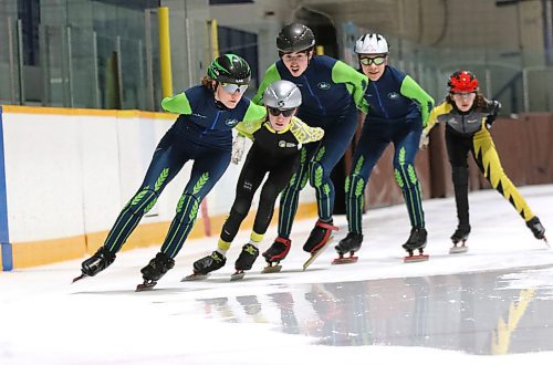 Jada Kasprick, left, leads Westman Speed Skating Club teammates Keagan Dyke (silver helmet), Adrian Lanoie (grey helmet), Jackson Chastellaine (white helmet) and Zoe Forbes (red helmet) into a corner during a training session at the Sportsplex in February. The club has already found ice at the Keystone Centre for next winter. (Perry Bergson/The Brandon Sun)
