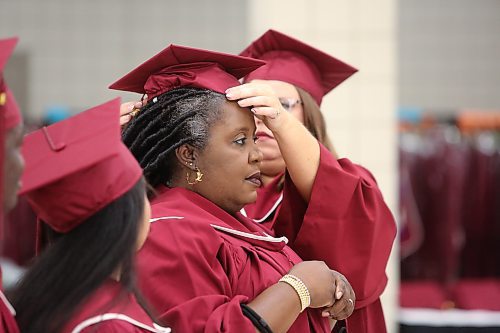 Assiniboine Community College students receive their caps and gowns at the Keystone Centre's UCT Pavilion Friday morning ahead of this year's summer graduation ceremony in Brandon. (Kyle Darbyson/The Brandon Sun)  