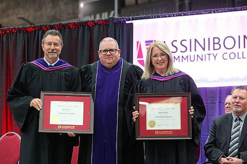 Former Brandon mayor Rick Chrest and his wife Karen pose for a photo with Assiniboine Community College president Mark Frison during Friday morning's graduation ceremony at the Keystone Centre. The Chrests both received an honorary diploma in community development at this year's grad ceremony. (Kyle Darbyson/The Brandon Sun)