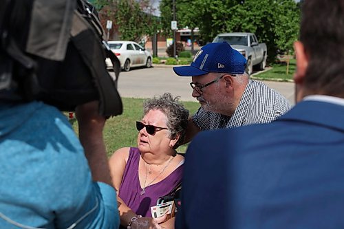 16062023
Dauphin residents Sandra and Glenn Kaleta speak to journalists on Friday in the wake of the tragedy that claimed the lives of 15 Dauphin residents and injured 10 others on the Trans Canada Highway at Carberry on Thursday. The Kaleta&#x2019;s are members of the Dauphin Active Living Centre and friends with some of the victims of the collision. 
(Tim Smith/The Brandon Sun)