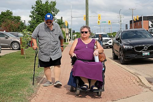 16062023
Dauphin residents Glenn and Sandra Kaleta head to the Dauphin Active Living Centre after speaking to journalists on Friday in the wake of the tragedy that claimed the lives of 15 Dauphin residents and injured 10 others on the Trans Canada Highway at Carberry on Thursday. The Kaleta&#x2019;s are members of the Dauphin Active Living Centre and friends with some of the victims of the collision. 
(Tim Smith/The Brandon Sun)