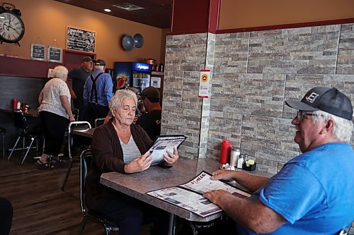 16062023
Debbie and Russell Murray have lunch at Corrina&#x2019;s on Main in Dauphin on Friday, a day after the tragedy that claimed the lives of 15 Dauphin residents and injured 10 others on the Trans Canada Highway at Carberry on Thursday. The Murray&#x2019;s have a family connection to one of the people in the bus that was involved in the collision.
(Tim Smith/The Brandon Sun)