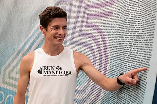 BROOK JONES / WINNIPEG FREE PRESS
Daniel Heschuk, who is from Neepawa, is competing in the Half Marathon National Championships at the Manitoba Marathon in Winnipeg, Man., Sunday, June 18, 2023. Heschuk points to his name in the list of participants while attending the Fit Expo at Investors Group Athletic Centre at the University of Manitoba in Winnipeg, Man., Friday, June 16, 2023. The Manitoba Marathon is celebrating its 45th running of the event. 
