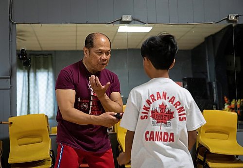 JESSICA LEE / WINNIPEG FREE PRESS

Dante Alambra, 72, practices Arnis with his grandson, Kenny Parinas, 10 at the Filipino Seniors Hall June 17, 2023. Alambra used to teach full time but student numbers have dropped since the pandemic. He now works as a security guard for a casino, teaching in the evenings and at weekends.

Reporter: AV Kitching