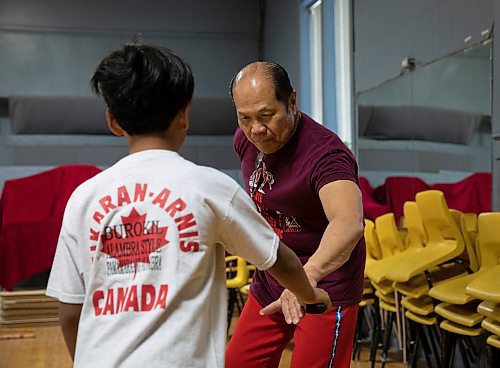 JESSICA LEE / WINNIPEG FREE PRESS

Dante Alambra, 72, practices Arnis with his grandson, Kenny Parinas, 10 at the Filipino Seniors Hall June 17, 2023. Alambra used to teach full time but student numbers have dropped since the pandemic. He now works as a security guard for a casino, teaching in the evenings and at weekends.

Reporter: AV Kitching