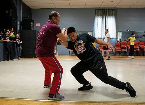 JESSICA LEE / WINNIPEG FREE PRESS

Dante Alambra, 72, practices Arnis with his nephew, Josh Anglo, at the Filipino Seniors Hall June 17, 2023. Alambra used to teach full time but student numbers have dropped since the pandemic. He now works as a security guard for a casino, teaching in the evenings and at weekends.

Reporter: AV Kitching