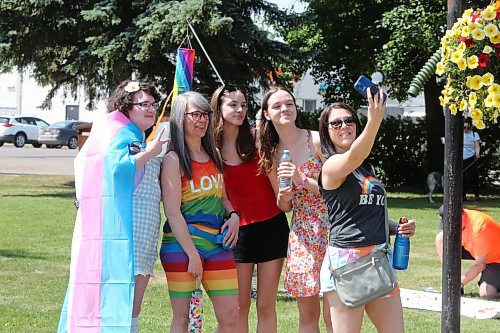 Members of the LGBTQ+ community and its allies gather at Brandon City Hall Saturday afternoon for the beginning of this year's Pride march. (Kyle Darbyson/The Brandon Sun)