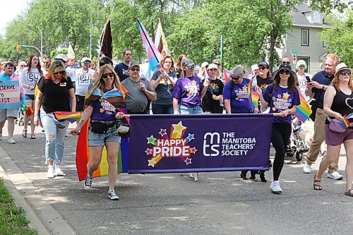 Members of the Manitoba Teachers' Society walk down Victoria Avenue towards Rideau Park during Saturday's Brandon Pride march. (Kyle Darbyson/The Brandon Sun)