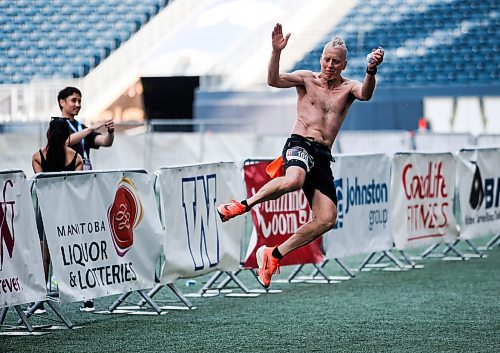 JOHN WOODS / WINNIPEG FREE PRESS
Evan Dorward jumps as he finishes his run at the 45th Manitoba Marathon in Winnipeg, Sunday, June 18, 2023. 

Reporter: Donald