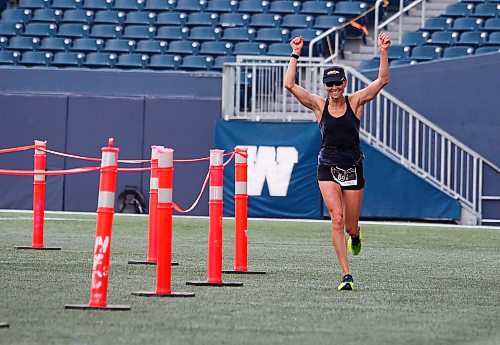 JOHN WOODS / WINNIPEG FREE PRESS
Dawn Neal celebrates winning the 45th Manitoba Marathon in Winnipeg, Sunday, June 18, 2023. 

Reporter: Donald