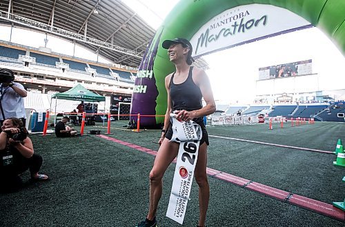 JOHN WOODS / WINNIPEG FREE PRESS
Dawn Neal celebrates winning the 45th Manitoba Marathon in Winnipeg, Sunday, June 18, 2023. 

Reporter: Donald