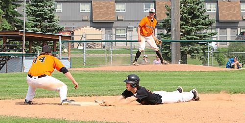 Porter Ewert of the Brandon Marlins dives safely back into the bag as Interlake Orioles first baseman Adam Newcombe (44) puts his mitt on the pickoff attempt by pitcher Alex Myers (9) at Andrews Field in the Baseball Manitoba U18U AAA League on Saturday at Andrews Field. For an in-depth look at this year's team, see Tuesday's edition of The Brandon Sun. (Perry Bergson/The Brandon Sun)
