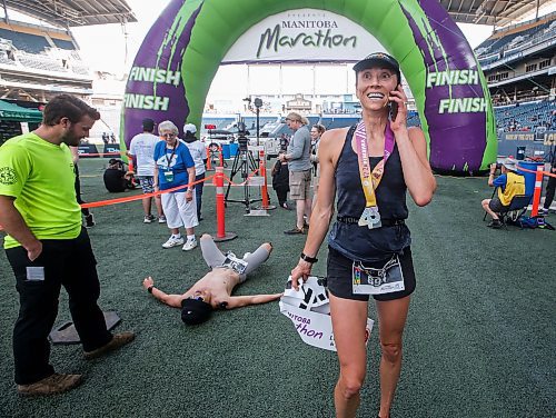 JOHN WOODS / WINNIPEG FREE PRESS
Dawn Neal celebrates winning the 45th Manitoba Marathon in Winnipeg, Sunday, June 18, 2023. 

Reporter: Donald