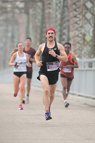 BROOK JONES / WINNIPEG FREE PRESS
Montreal resident Timothy Seirer crosses the BDI bridge while competing in the Half Marathon at the Manitoba Marathon in Winnipeg, Man., Sunday, June 18, 2023. 