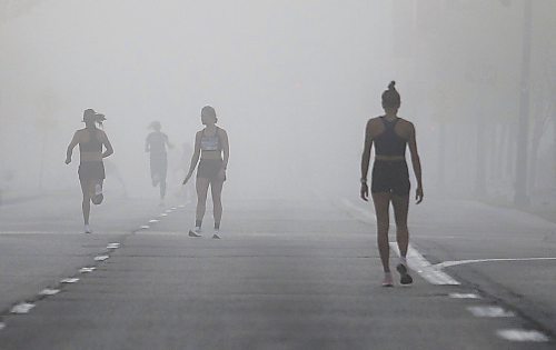 JOHN WOODS / WINNIPEG FREE PRESS
Runners warm up in the fog prior to the 45th Manitoba Marathon in Winnipeg, Sunday, June 18, 2023. 

Reporter: Donald