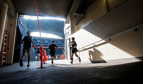 JOHN WOODS / WINNIPEG FREE PRESS
Runners enter the stadium and finish area in the 45th Manitoba Marathon in Winnipeg, Sunday, June 18, 2023. 

Reporter: Donald