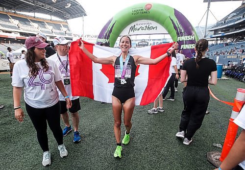JOHN WOODS / WINNIPEG FREE PRESS
Elissa Legault celebrates winning the half marathon at the 45th Manitoba Marathon in Winnipeg, Sunday, June 18, 2023. 

Reporter: Donald