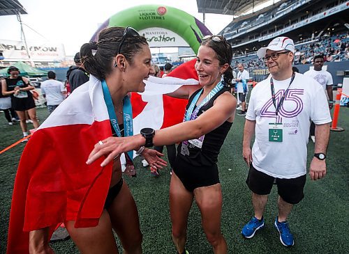 JOHN WOODS / WINNIPEG FREE PRESS
Elissa Legault, right, and Kinsey Middleton, celebrate coming 1st and 2nd, respectively, in the half marathon at the 45th Manitoba Marathon in Winnipeg, Sunday, June 18, 2023. 

Reporter: Donald