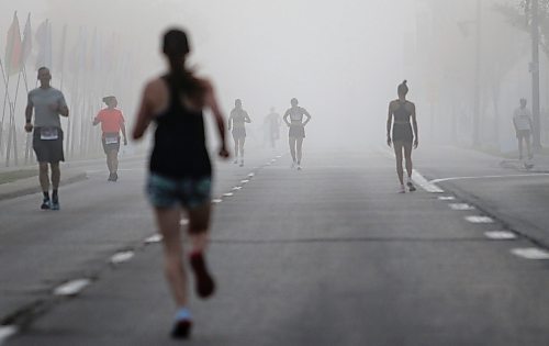 JOHN WOODS / WINNIPEG FREE PRESS
Runners warm up in the fog prior to the 45th Manitoba Marathon in Winnipeg, Sunday, June 18, 2023. 

Reporter: Donald