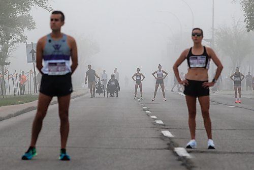 JOHN WOODS / WINNIPEG FREE PRESS
Runners warm up in the fog prior to the 45th Manitoba Marathon in Winnipeg, Sunday, June 18, 2023. 

Reporter: Donald