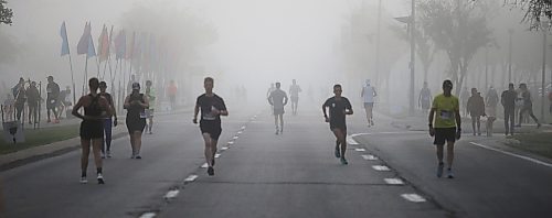 JOHN WOODS / WINNIPEG FREE PRESS
Runners warm up in the fog prior to the 45th Manitoba Marathon in Winnipeg, Sunday, June 18, 2023. 

Reporter: Donald