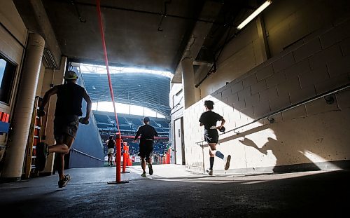 JOHN WOODS / WINNIPEG FREE PRESS
Runners enter the stadium and finish area in the 45th Manitoba Marathon in Winnipeg, Sunday, June 18, 2023. 

Reporter: Donald