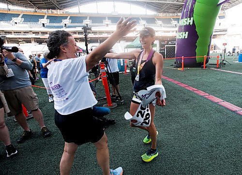 JOHN WOODS / WINNIPEG FREE PRESS
Dawn Neal celebrates winning the 45th Manitoba Marathon in Winnipeg, Sunday, June 18, 2023. 

Reporter: Donald